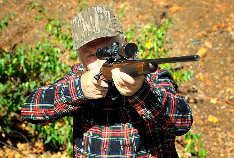 Photo of Stan firing the Mossberg Revere rifle.